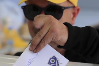 Member of Hezbollah who lost fingures in Israel's pagers' detonation casts his vote in Lebanon municipal elections 